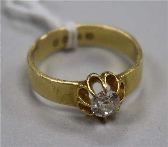 A Victorian 18ct gold and claw set solitaire diamond ring, size Q.